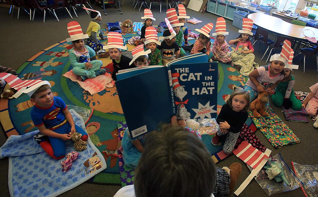 Transitional kindergarten teacher Kathy Alexander reads 'The Cat in the Hat' by Dr. Seuss at Healdsburg Elementary School in Healdsburg on Thursday, March 3, 2017. (KENT PORTER/ PD)