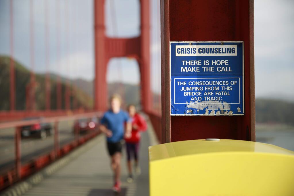 A crisis and emergency call box on the Golden Gate Bridge. The nation's suicide rate increased 25 percent between 1999 and 2016, according to a new report from the Centers for Disease Control. (RAMIN RAHIMIAN / New York Times)
