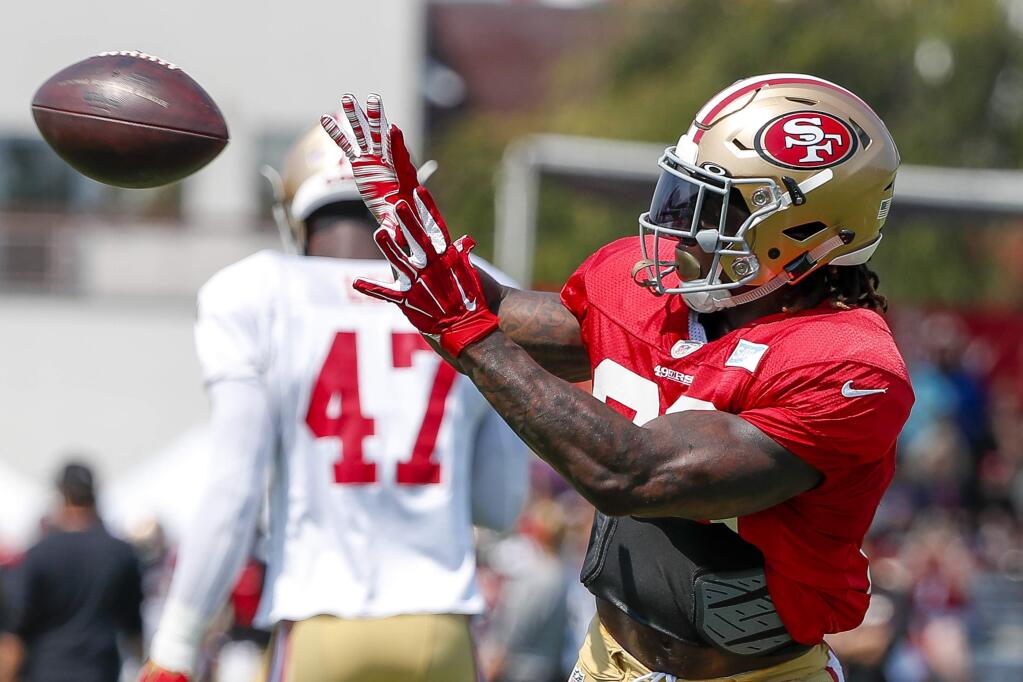 San Francisco 49ers running back Jerick McKinnon catches a pass during practice at the team's headquarters Saturday, July 28, 2018, in Santa Clara. (AP Photo/Tony Avelar)