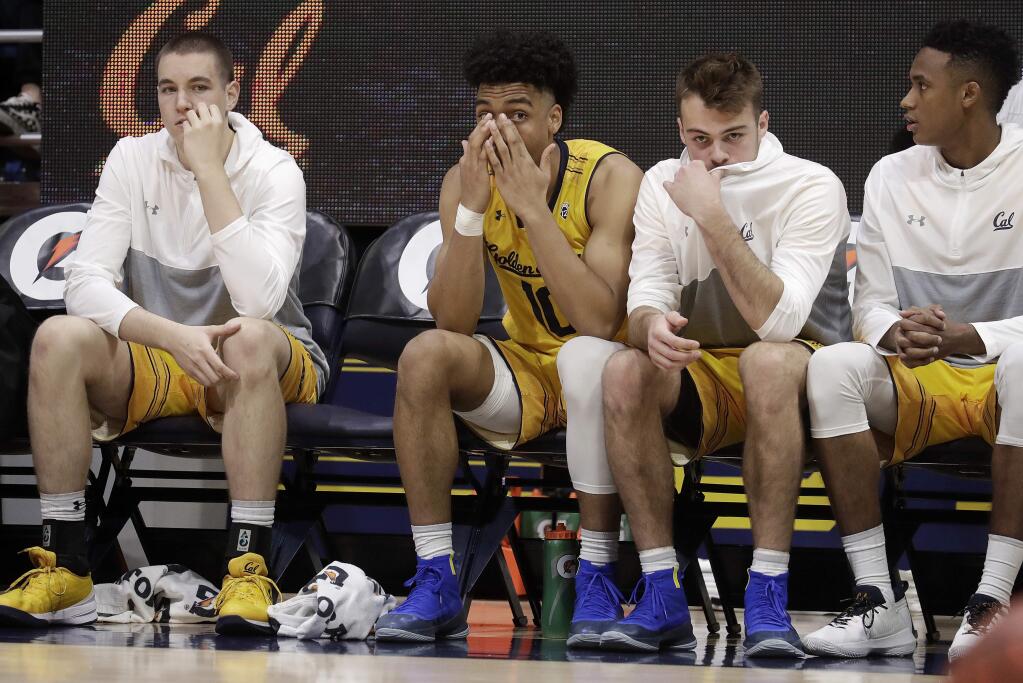 Cal players react on the bench during the first half of the team's game against Portland State in Berkeley, Thursday, Dec. 21, 2017. Portland State won 106-81. (AP Photo/Jeff Chiu)