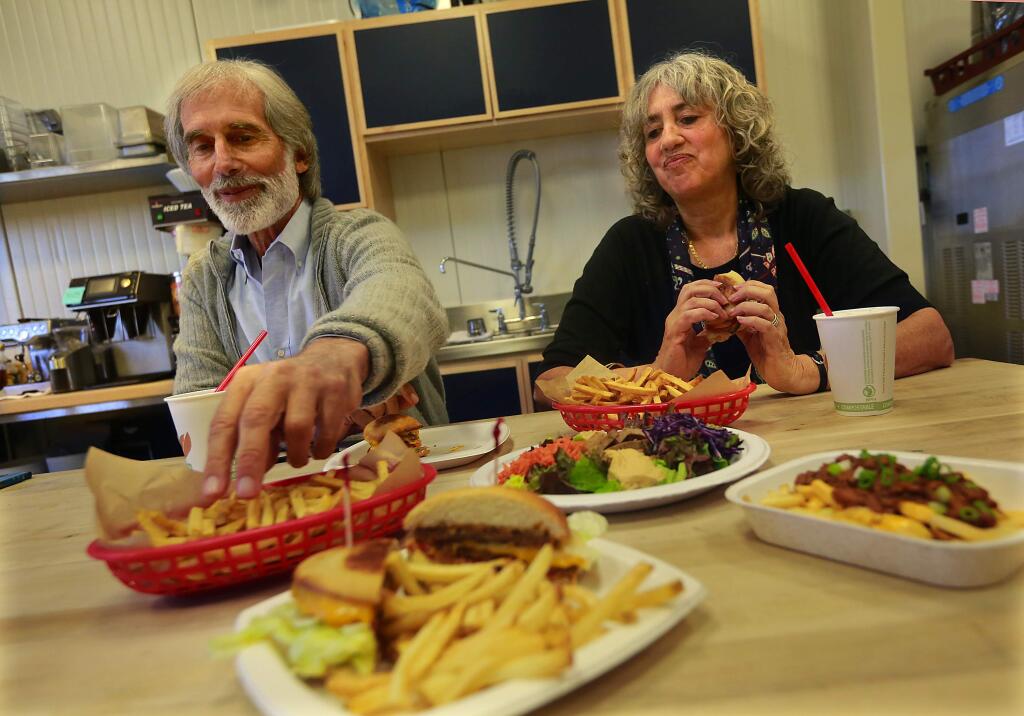 Andy and Rachel Berliner sample veggie burgers and cholesterol-free fries they will serve at their Amy's Kitchen drive-thru restaurant in Rohnert Park. (Photo by John Burgess/The Press Democrat)