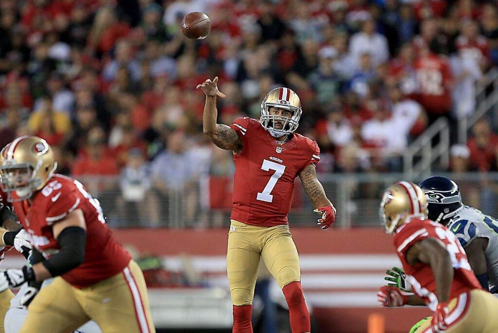 Colin Kaepernick launches a pass that fell incomplete in the 49ers' Thursday night loss at home to the Seahawks in October. (Kent Porter / Press Democrat)
