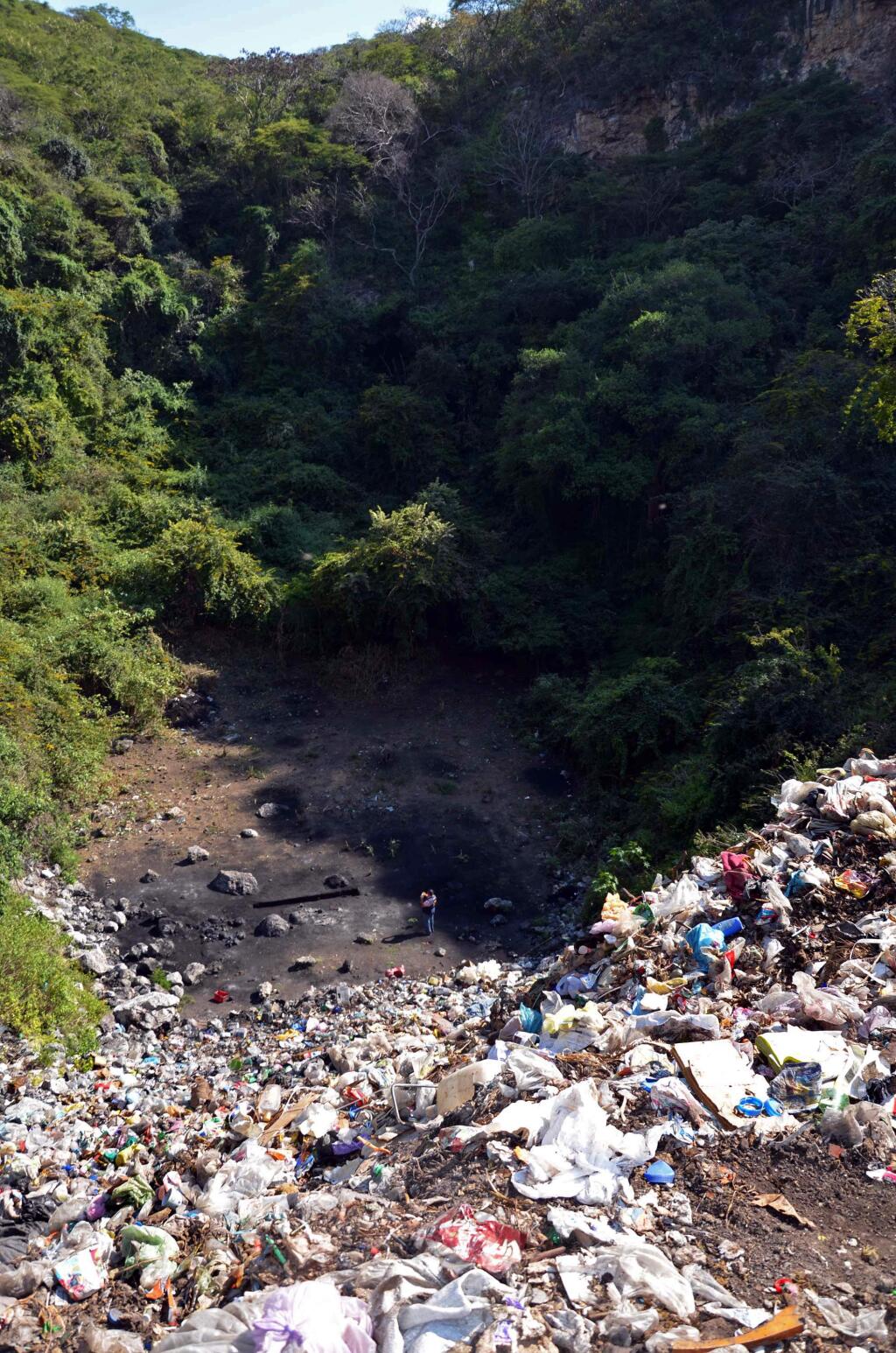 This is the site near the town of Cocula, Mexico, pictured on Saturday, Nov. 8, 2014, where according to investigators, drug gang members made 43 teachers college students disappear, piling their bodies like cord wood on a pyre that burned for 15 hours and then wading into the ashes to pulverize, bag and dispose of remaining teeth and bones. In a somber presentation, Attorney General Jesus Murillo Karam laid out on Friday what investigators think happened to the students who have not been seen since being attacked by police Sept. 26 in the southern city of Iguala. (AP Photo/Alejandrino Gonzalez)