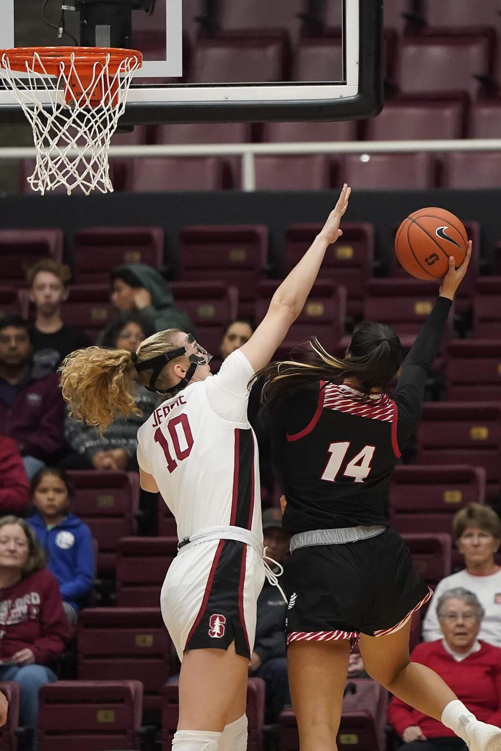 Stanford forward Alyssa Jerome (10) blocks a shot by Eastern Washington center Bella Cravens (14) during the first half of an NCAA college basketball game Tuesday, Nov. 5, 2019, in Stanford, Calif. (AP Photo/Tony Avelar)