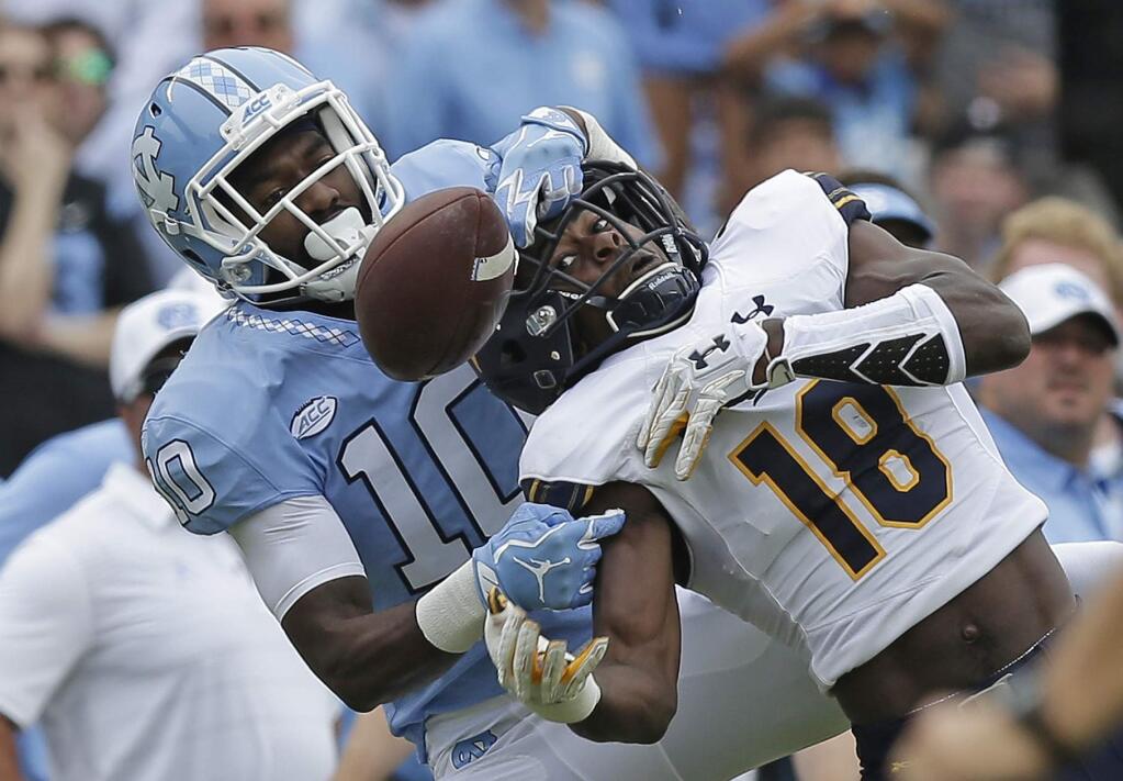 North Carolina's Andre Smith (10) breaks up a pass intended for Cal's Marloshawn Franklin Jr. (18) during the first half in Chapel Hill, N.C., Saturday, Sept. 2, 2017. (AP Photo/Gerry Broome)