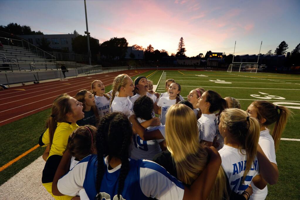 The Analy Tigers huddle for a cheer before their girls varsity soccer match against the Elsie Allen Lobos on Thursday, Oct. 6, 2016. (Alvin Jornada / The Press Democrat)