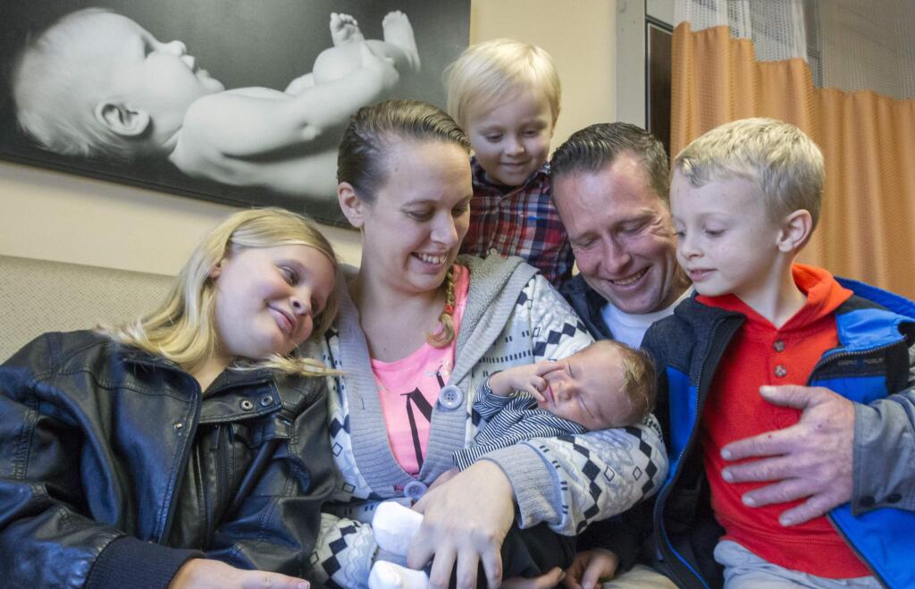 The first baby born in 2017 at the Sonoma Valley Hospital is Brett Christensen, born to Brittany and Scott, at 1:30 P.M. on January 1. The family, from left: Sarah, 7, mother Brittany, Bryce, 3, father Scott, and Blake, 5. (Photo by Robbi Pengelly/Index-Tribune)