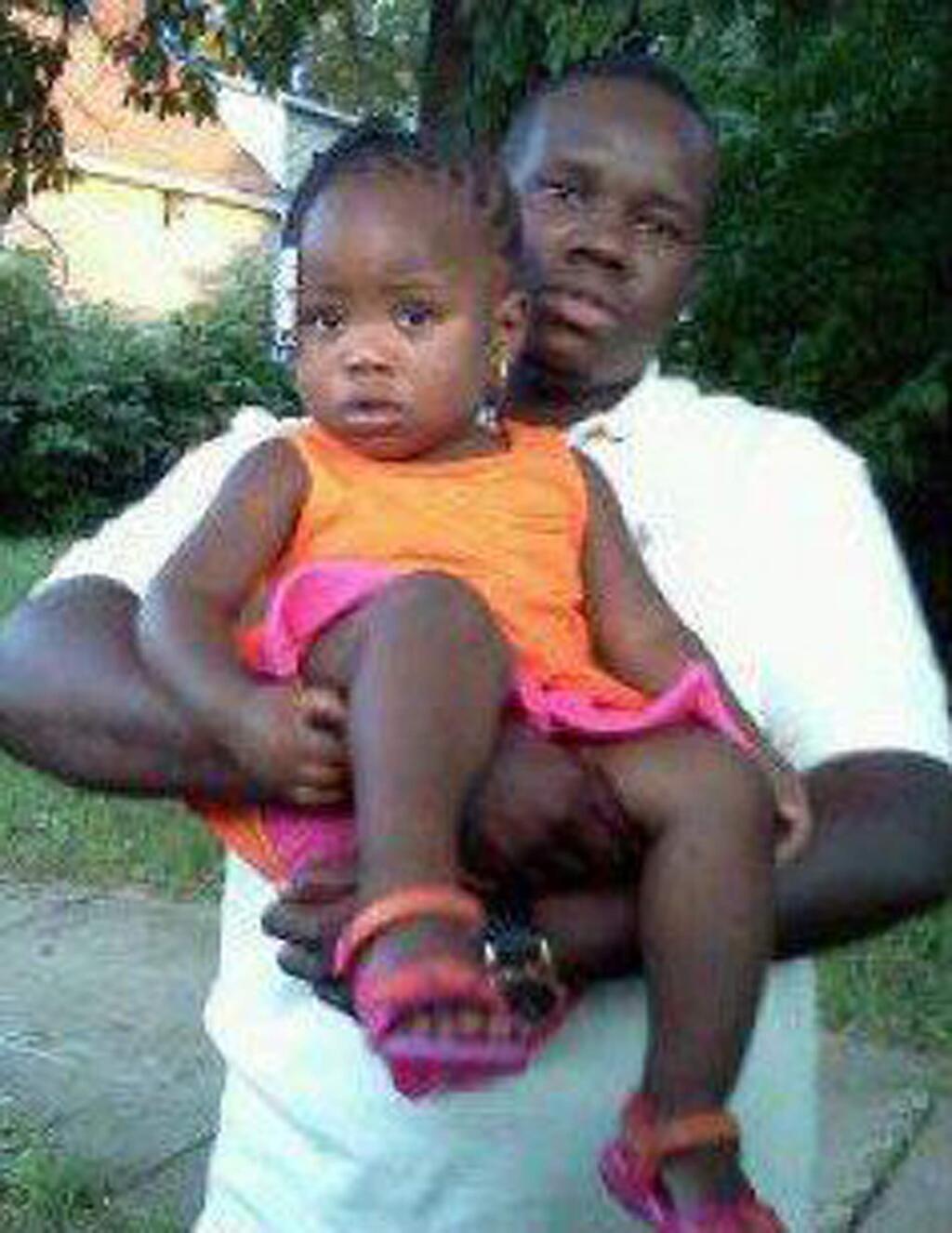 This undated family photo supplied by Christina Wilson shows Anthony Lamar Smith holding his daughter Autumn Smith. Anthony Lamar Smith was killed in 2011 during a confrontation with police. A judge may be close to a ruling in the case against Former St. Louis police officer Jason Stockley, who is charged with first-degree murder and armed criminal action in the December 2011 shooting death of Smith. Gov. Eric Greitens says he's has put the National Guard on standby in case unrest breaks out. (Family photo courtesy Christina Wilson via AP)