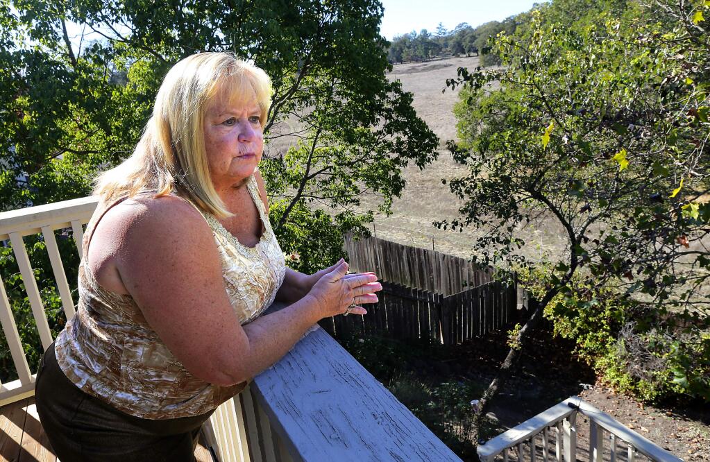 Cheryl Pabros is worried the open space behind her Windsor home in the Deer Creek neighborhood will become the site of a sewer plant for the Lytton Pomos. (JOHN BURGESS / The Press Democrat)
