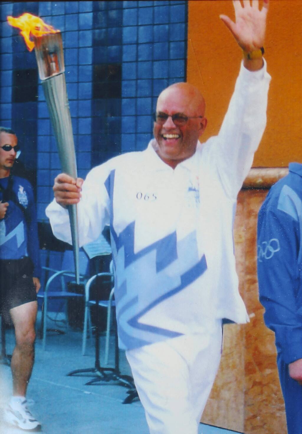 Tom Francois carrying the Olympic torch in 2002.(Photo courtesy Tom Francois)