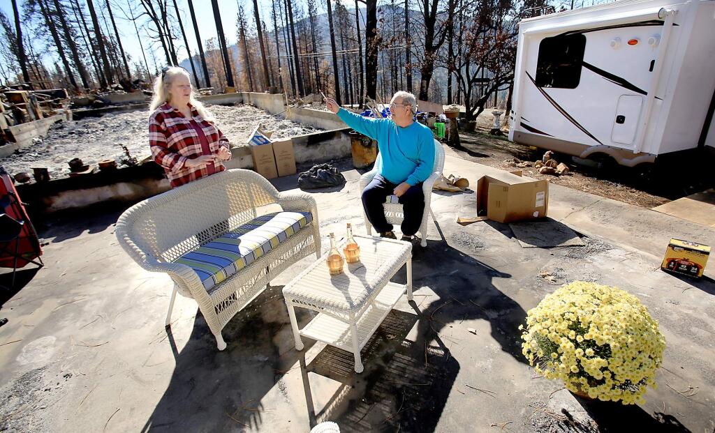 Gary and Laura Lynn Ledson rented a trailer and placed it on their burned homesite in Cobb, Tuesday Nov. 10, 2015. Their home, along with hundreds of others, was razed by the Valley fire in September. (Kent Porter / Press Democrat) 2015
