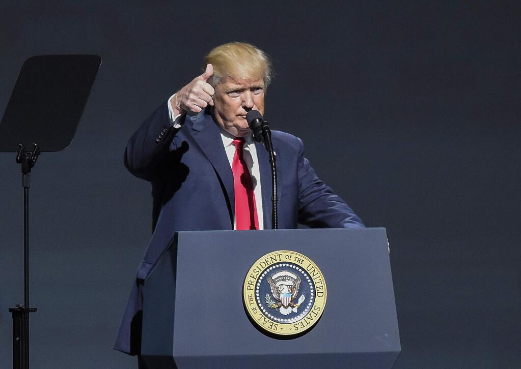 President Donald Trump gives a thumbs-up as speaks at the National Rifle Association-ILA Leadership Forum, Friday, April 28, 2017, in Atlanta. The NRA is holding its 146th annual meetings and exhibits forum at the Georgia World Congress Center. (AP Photo/Mike Stewart)