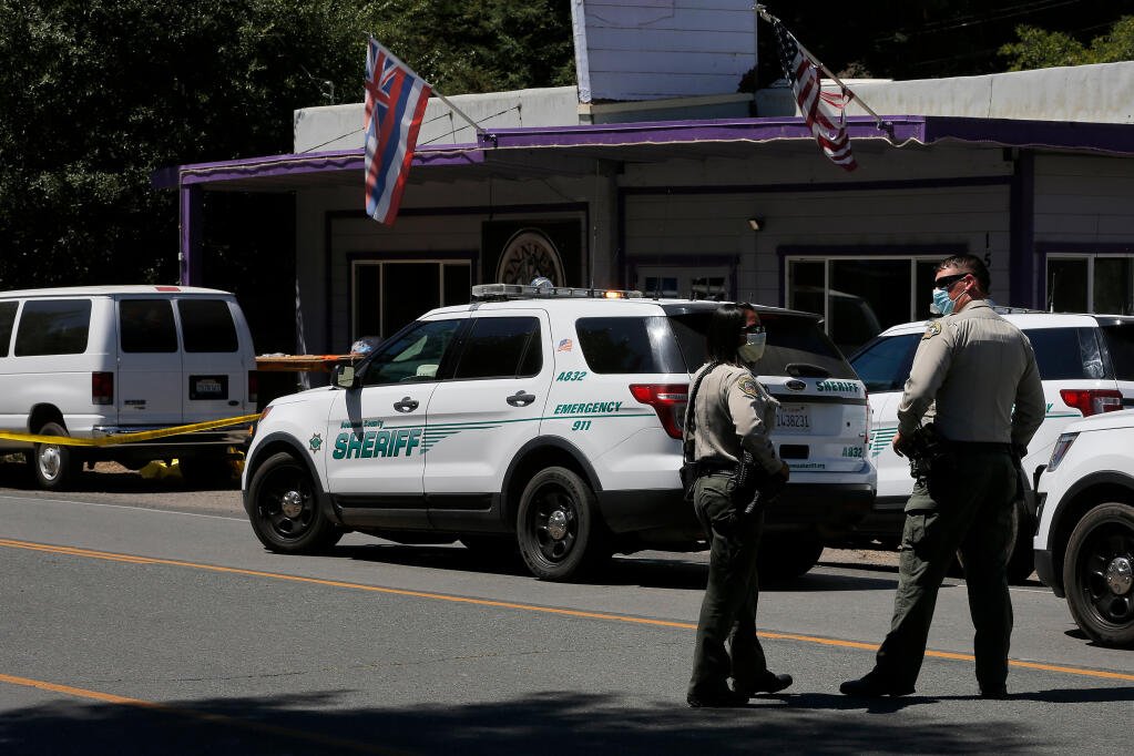 Sonoma County sheriff deputies stand at the scene of an in-custody death that occurred in front of a commercial business on River Road in Guerneville, California, on Saturday, August 15, 2020. (Alvin A.H. Jornada / The Press Democrat)