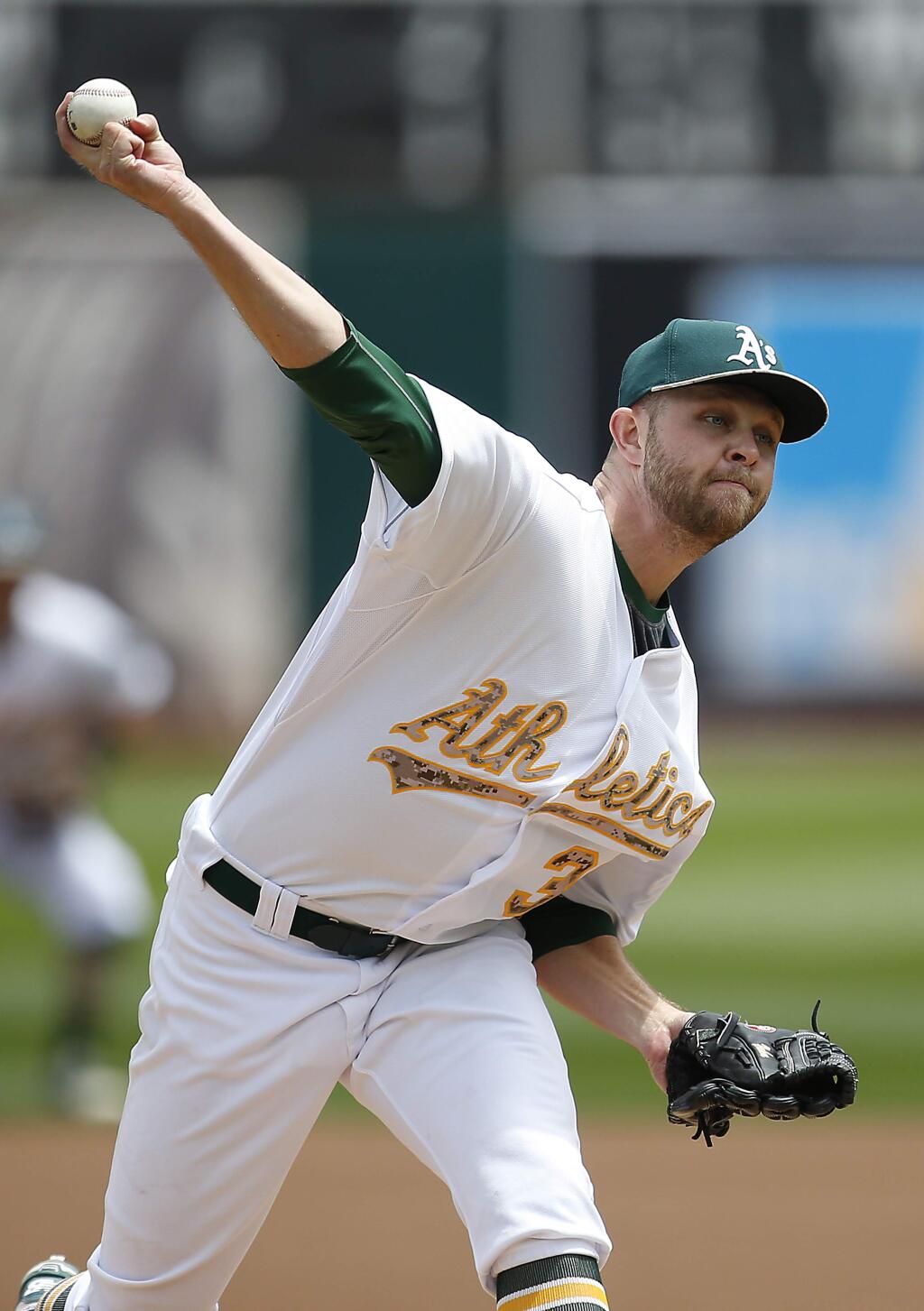 Oakland Athletics starting pitcher Jesse Hahn works against the Detroit Tigers in the first inning of a baseball game Monday, May 25, 2015, in Oakland, Calif. (AP Photo/Tony Avelar)