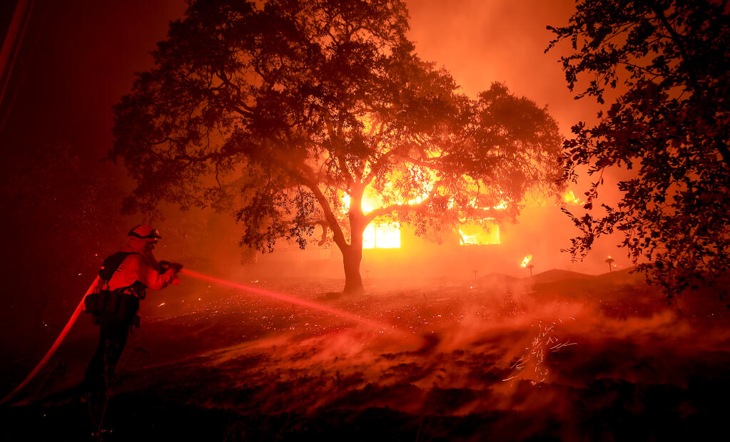 A home near St. Helena burns in the Glass fire, Sunday, Sept. 27, 2020. (Kent Porter / The Press Democrat)