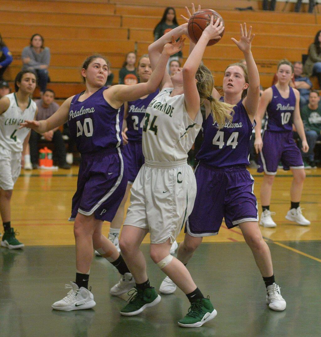 SUMNER FOWLER/FOR THE ARGUS-COURIERPetaluma defenders Sheriene Arikat (40) and Rose Nevin (44) surround Casa's Samantha Dedrickson in a game played last season. Both Arkat and Nevin return for the T-Girls.