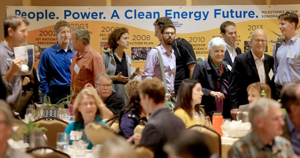 At the Business of Local Energy Symposium in Petaluma, Thursday Oct. 23, 2014 convention goers take a break from meetings to file in for their lunch. (Kent Porter / Press Democrat) 2014