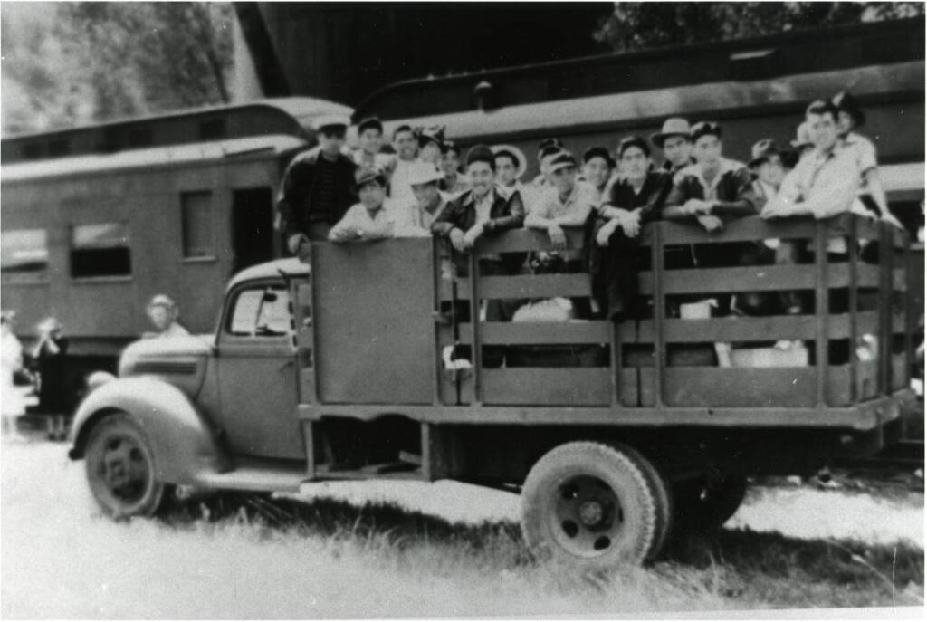 Gaye LeBaron collectionJapanese men from Sonoma County stand on the bed of a truck to be sent to an internment camp in Colorado.
