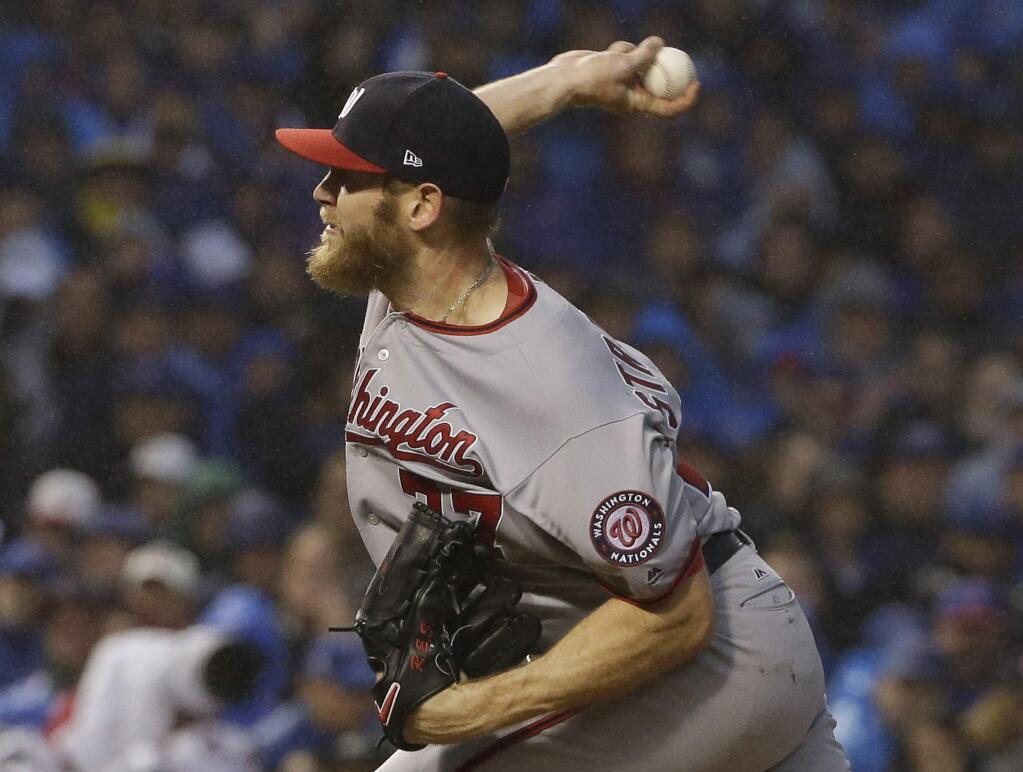 Washington Nationals starting pitcher Stephen Strasburg throws during the seventh inning of Game 4 of the National League Division Series against the Chicago Cubs, Wednesday, Oct. 11, 2017, in Chicago. (AP Photo/Nam Y. Huh)
