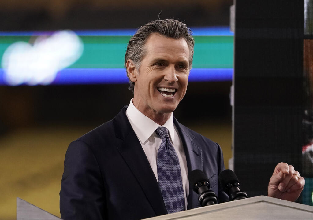 FILE - In this Tuesday, March 9, 2021, file photo, California Gov. Gavin Newsom delivers his State of the State address from Dodger Stadium in Los Angeles. Newsom and his Democratic allies launched a political committee Monday, March 15 to stop a proposed recall election that could oust him from office.  (AP Photo/Mark J. Terrill, File)