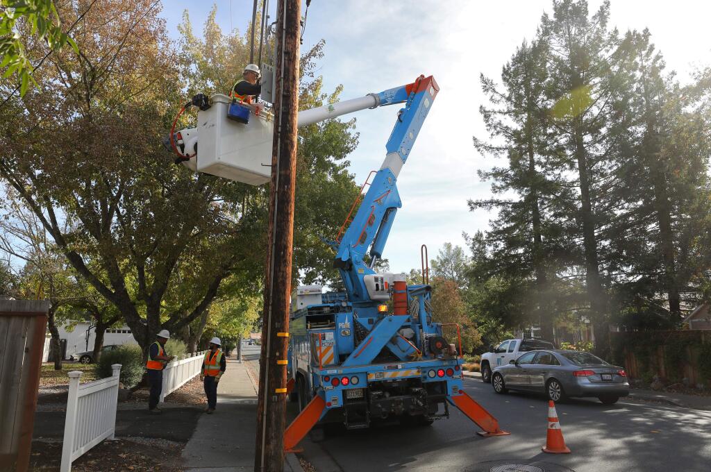 PG&E crew foreman Jeremy Woodruff restores power to the Rincon 1102 circuit, on Middle Rincon Road, in Santa Rosa on Thursday, October 24, 2019. (Christopher Chung/ The Press Democrat)