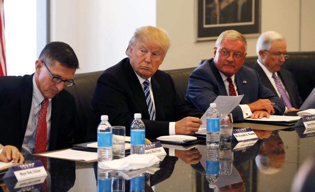 Republican presidential candidate Donald Trump participates in a roundtable discussion on national security in his offices in Trump Tower in New York, Wednesday, Aug. 17, 2016. From left, are, Ret. Army Gen. Mike Flynn, Trump, Ret. Army Lt. Gen. Keith Kellogg and Sen. Jeff Sessions, R-Ala. (AP Photo/Gerald Herbert)