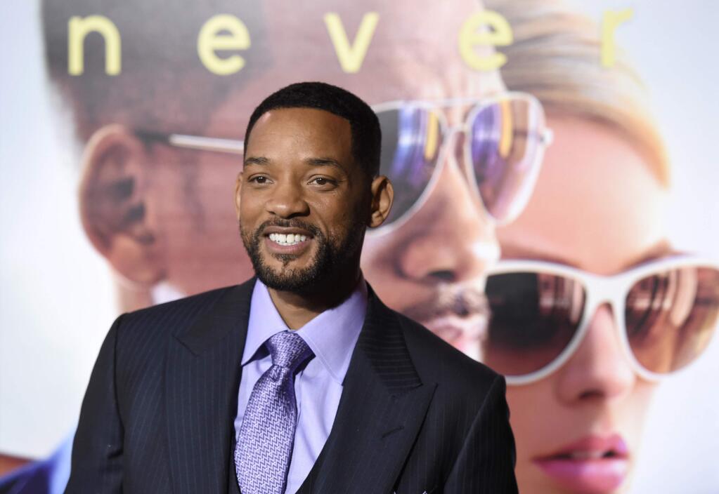 Will Smith arrives at the world premiere of 'Focus' at the TCL Chinese Theatre on Tuesday, Feb. 24, 2015, in Los Angeles. (Photo by Chris Pizzello/Invision/AP)