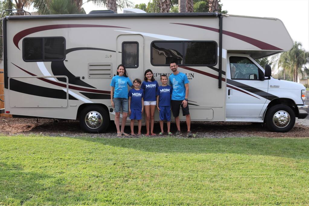 The Buschos — from the left, Jessica,  Brennan, Gianna, Connor and Justin —and their godsend of an RV. (Buscho family)