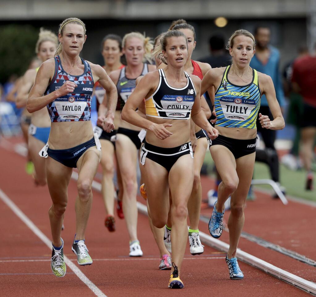 Kim Conley, center wins the first heat in the women's 5,000-meter run at the U.S. Olympic Track and Field Trials, Thursday, July 7, 2016, in Eugene Ore. (Marcio Jose Sanchez / Associated Press)