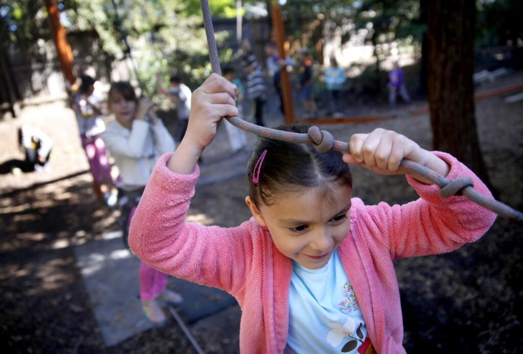 Isabel Lester, 6, does a ropes course during Camp Vertical at Vertex Climbing Center in Santa Rosa, on Wednesday, March 23, 2016. (BETH SCHLANKER/ The Press Democrat)