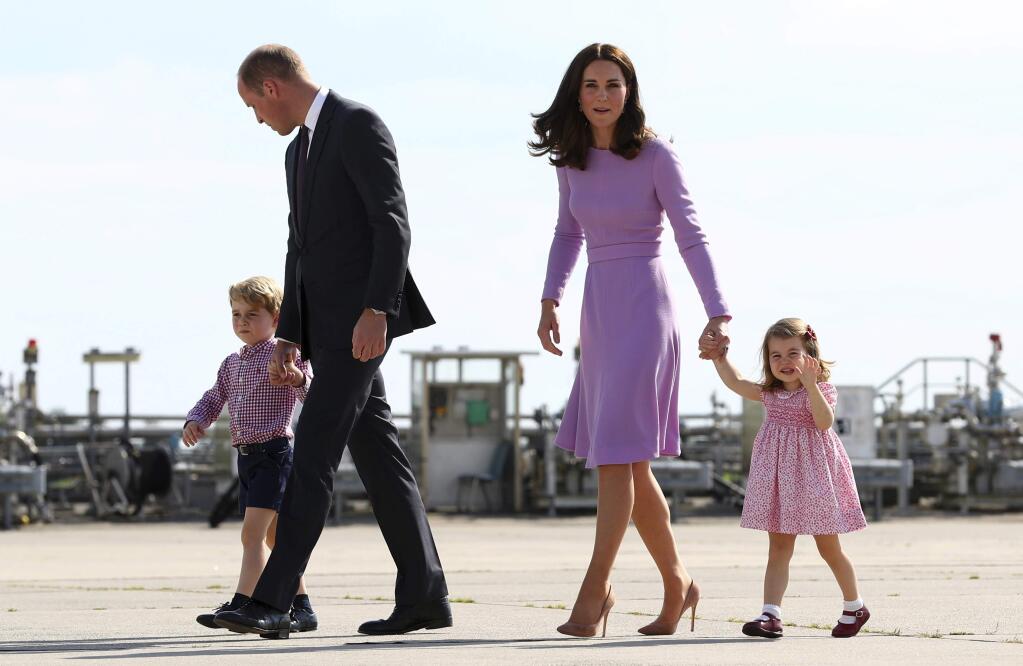 FILE - In this Friday, July 21, 2017 file photo Britain's Prince William, second left, and his wife Kate, the Duchess of Cambridge, second right, and their children, Prince George, left, and Princess Charlotte, right are on their way to board a plane in Hamburg, Germany. The Duke and Duchess of Cambridge say their third child will be due in April, it was announced on Tuesday, Oct. 17, 2017. ( Christian Charisius/Pool Photo via AP, File)
