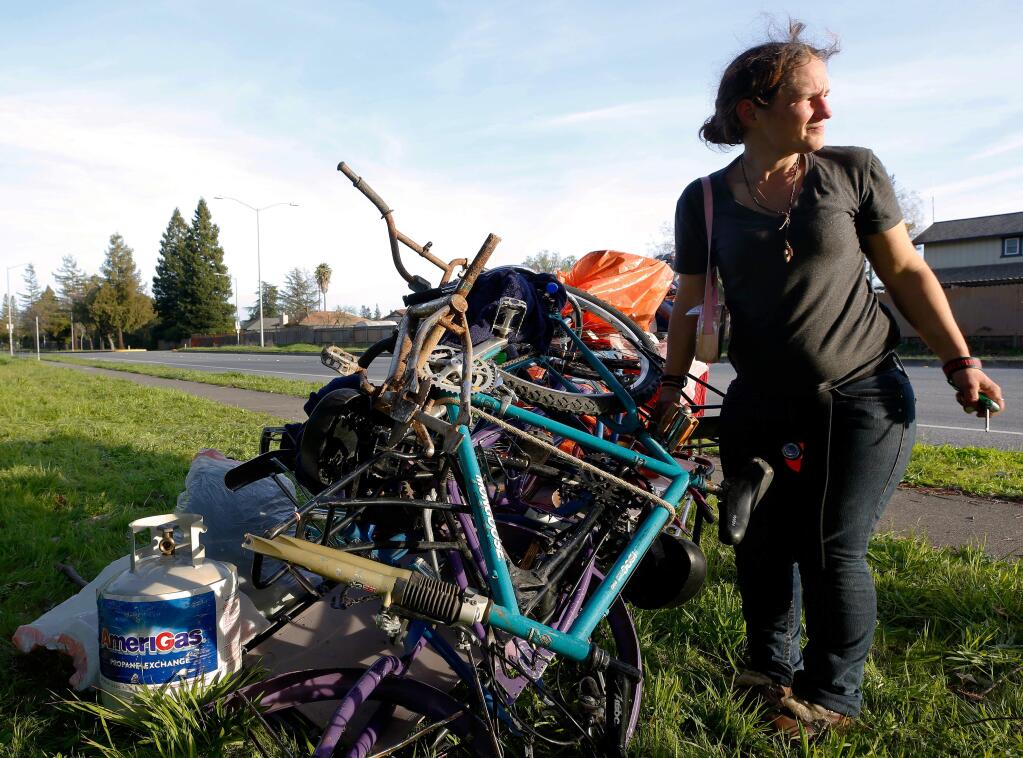 Lisa Swaney finishes packing her belongings alongside Third Street near A Place to Play, where a group of homeless people who set up camp at the park were required to displace again after being previously evicted from the encampment on Joe Rodota Trail, in Santa Rosa, California, on Wednesday, February 19, 2020. (Alvin Jornada / The Press Democrat)