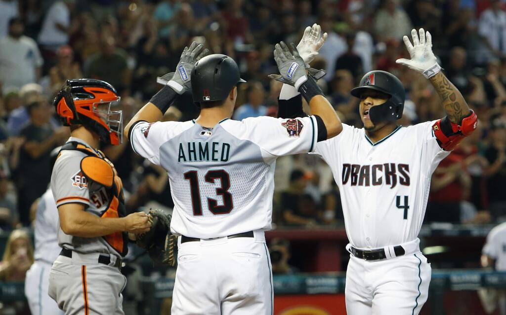 The Arizona Diamondbacks Ketel Marte celebrates with Nick Ahmed after hitting a two-run home run against the San Francisco Giants in the first inning, Saturday, Aug. 4, 2018, in Phoenix. (AP Photo/Rick Scuteri)