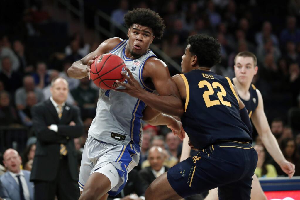 Duke center Vernon Carey Jr. (1) maneuvers around Cal forward Andre Kelly (22) during the first half of the first round of the 2K Empire Classic, Thursday, Nov. 21, 2019, in New York. (AP Photo/Kathy Willens)