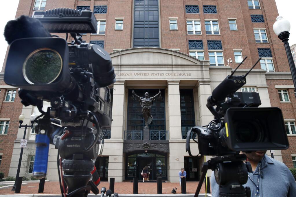 Television cameras are set outside of federal court as the trial of former Trump campaign chairman Paul Manafort continues, in Alexandria, Va., Monday, Aug. 13, 2018. (AP Photo/Jacquelyn Martin)