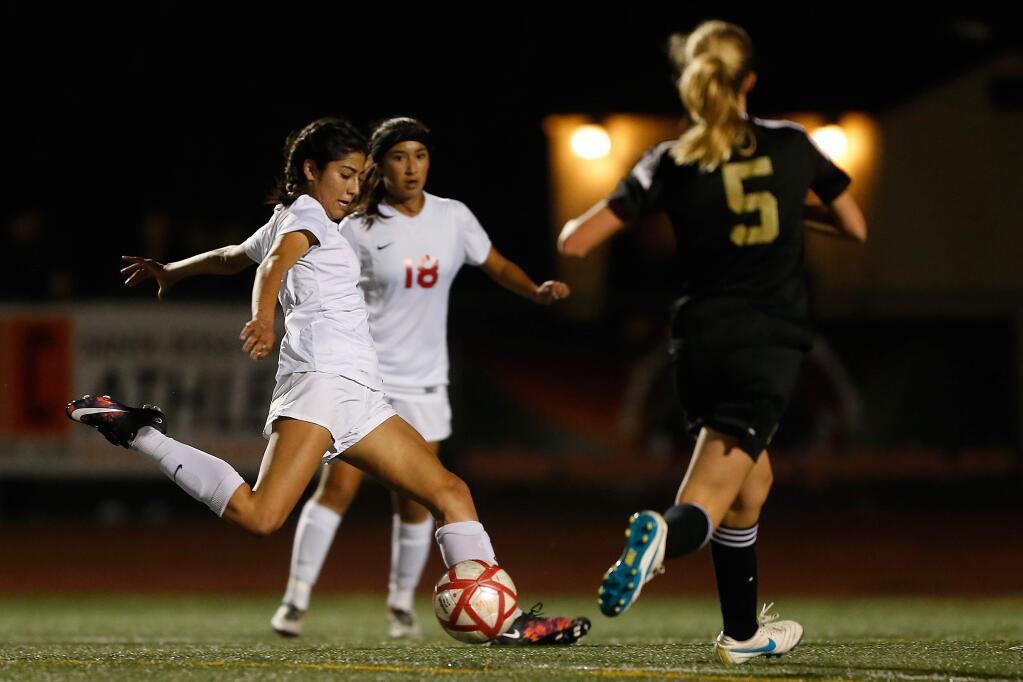 Montgomery's Gabby Albavera, left, scores a goal in the NCS Division 1 girls soccer final against Windsor on Nov. 12, 2016. Albavera is one of the top returning seniors for the defending section champions this season. (Alvin Jornada / The Press Democrat)