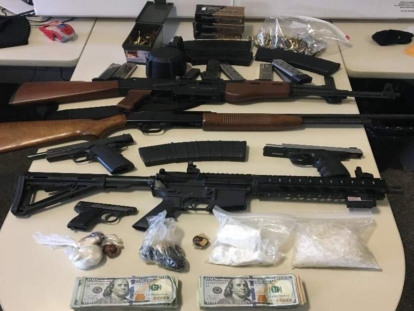 Santa Rosa police found guns, cash and drugs during a probation check on Monday, May 15, 2017. (COURTESY OF SANTA ROSA POLICE DEPARTMENT)