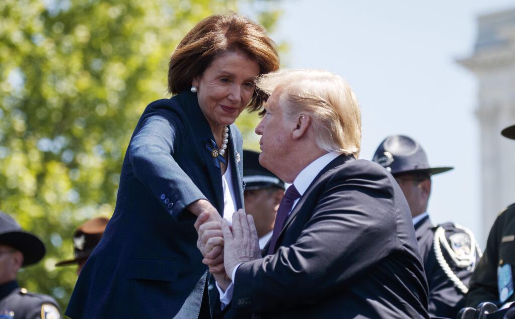President Donald Trump shakes hands with Speaker of the House Nancy Pelosi of Calif., during the 38th Annual National Peace Officers' Memorial Service at the U.S. Capitol, Wednesday, May 15, 2019, in Washington. Pelosi said Wednesday that the U.S. must avoid war with Iran and she warned the White House has ‚Äúno business‚Äù moving toward a Middle East confrontation without approval from Congress. (AP Photo/Evan Vucci)