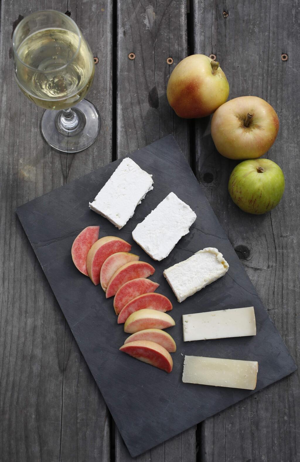 Tomales Farmstead Creamery was a Good Food Award in the cheese category in January. Here its cheeses are paired with Devoto Orchard's Estate Cider and slices of Pink Pearl apples in Sebastopol. (BETH SCHLANKER/ The Press Democrat)