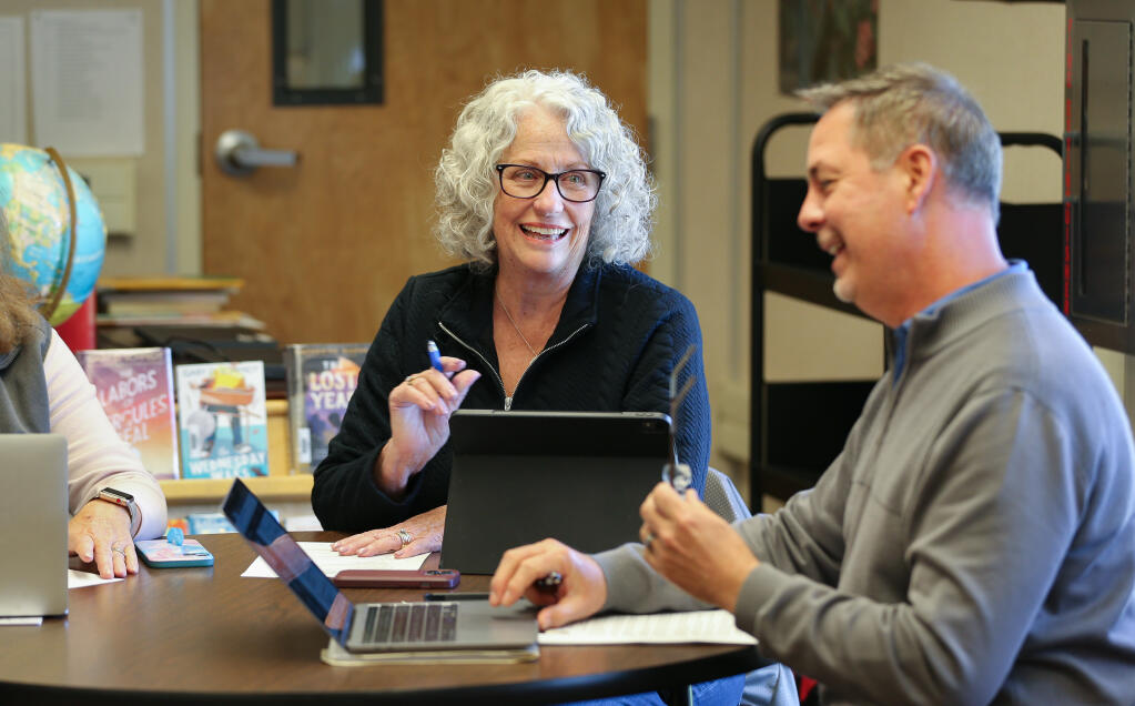 Kenwood School District board president Cheryl Ghisla, left, talks with superintendent Nate Myers during the board of trustees meeting in the Kenwood School library in Kenwood on Thursday, April 4, 2024.  (Christopher Chung/The Press Democrat)
