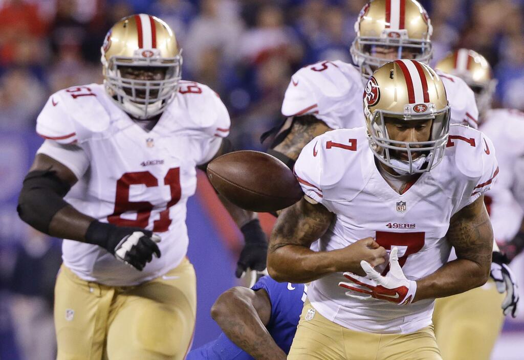 San Francisco 49ers quarterback Colin Kaepernick (7) fumbles the ball as he runs against the New York Giants during the second quarter of an NFL football game, Sunday, Oct. 11, 2015, in East Rutherford, N.J. (AP Photo/Seth Wenig)