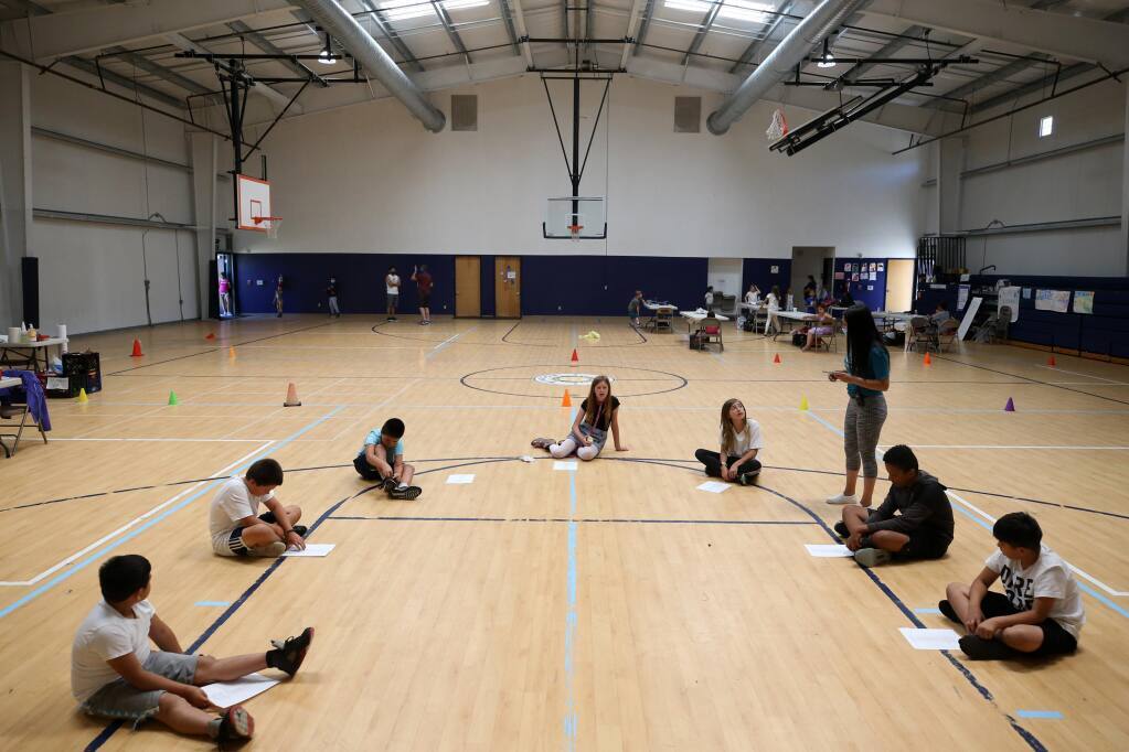 Members of the green group practice singing "Old Town Road" at the Boys and Girls Club summer camp at Windsor Middle School in Windsor, on Thursday, July 30, 2020. (Beth Schlanker / The Press Democrat)