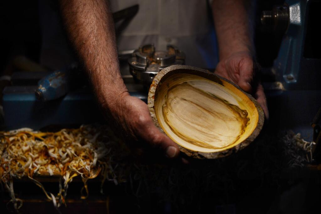 Woodturning artist Jerry Kermode making a Silver Maple wood bowl that he donated for the silent auction during Empty Bowls, the 7th annual dinner and art auction; a benefit for the Redwood Empire Food Bank held Saturday in Santa Rosa. April 29, 2017.(Photo: Erik Castro/for The Press Democrat)