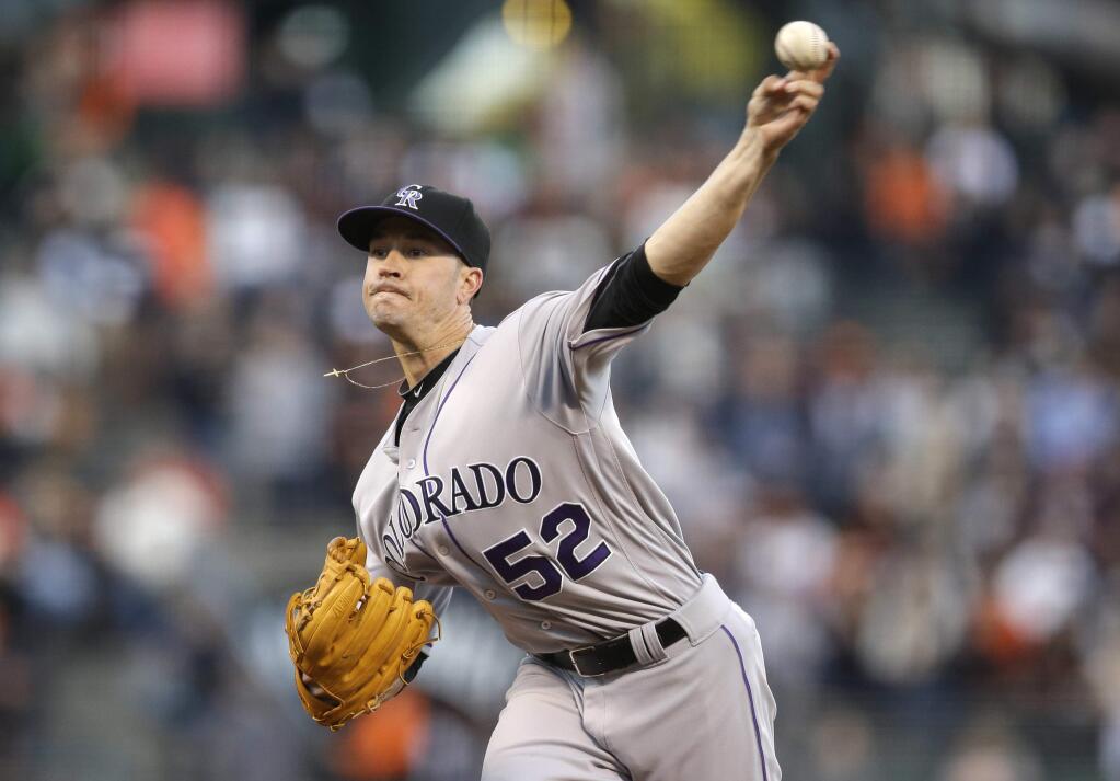 Colorado Rockies starter Chris Rusin throws to the San Francisco Giants during the first inning of a baseball game Thursday, May 5, 2016, in San Francisco. (AP Photo/Marcio Jose Sanchez)