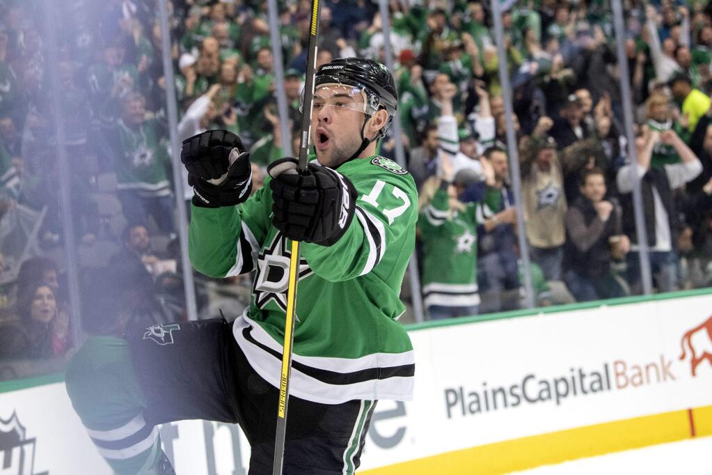 Dallas Stars center Devin Shore celebrates after scoring a goal against the San Jose Sharks during the first period of an NHL hockey game Thursday, Nov. 8, 2018, in Dallas. (AP Photo/Jeffrey McWhorter)
