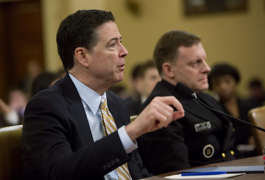 From left: FBI Director James Comey and National Security Agency Director Adm. Michael Rogers testify before the House Permanent Select Committee on Intelligence on Capitol Hill, in Washington, March 20, 2017. Comey publicly confirmed an investigation into Russian interference in the presidential election and whether associates of the president were in contact with Moscow at the hearing on Monday. (Eric Thayer/The New York Times)