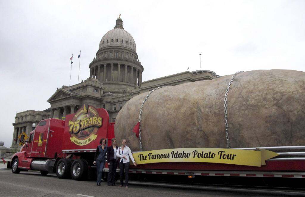 FILE - In this March 30, 2012, file photo, the Idaho Potato Commission displays its tuber replica on the street in front of the Idaho Capitol in Boise. The Idaho Potato Commission says its traveling advertisement, the Great Big Idaho Potato Truck, could roll on indefinitely. (AP Photo/John Miller, File)