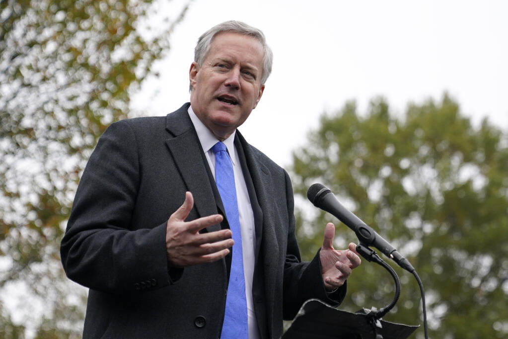 FILE - White House chief of staff Mark Meadows speaks with reporters outside the White House, Oct. 26, 2020, in Washington. Meadows, who as chief of staff to President Donald Trump promoted his lies of mass voter fraud, is facing increasing scrutiny about his own voter registration status. Public records show he is registered to vote in two states, including North Carolina, where he listed a mobile home he did not own, and may never have visited, as his legal residence weeks before casting a ballot in the 2020 election. (AP Photo/Patrick Semansky, File)