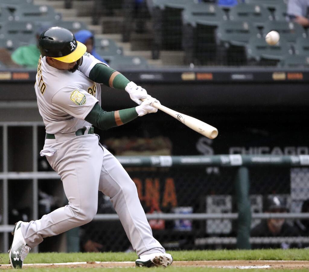 The Oakland Athletics' Franklin Barreto hits a three-run home run against the Chicago White Sox during the second inning of the first game of a doubleheader in Chicago, Friday, June 22, 2018. (AP Photo/Nam Y. Huh)