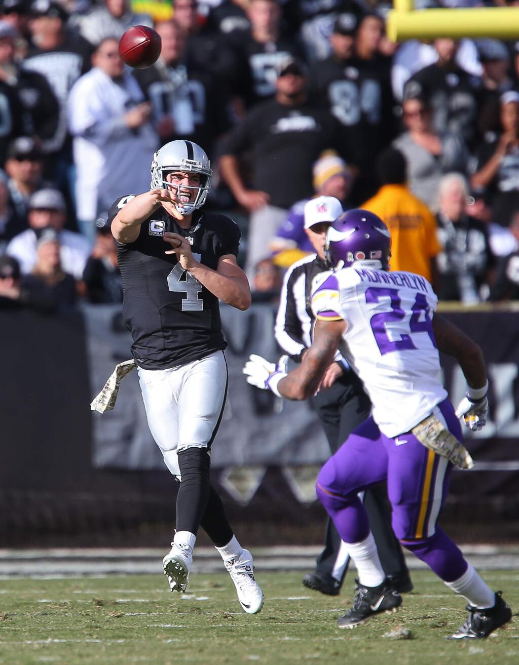 Oakland Raiders quarterback Derek Carr throws a pass against the Minnesota Vikings, during their game in Oakland on Sunday, November 15, 2015. The Vikings defeated the Raiders 30-14.(Christopher Chung/ The Press Democrat)